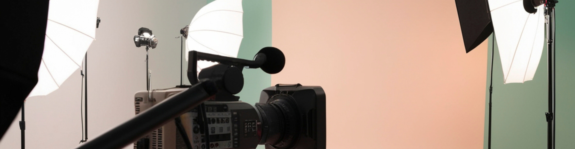 Camera on tripod with lighting kit and coloured gels for a media shoot