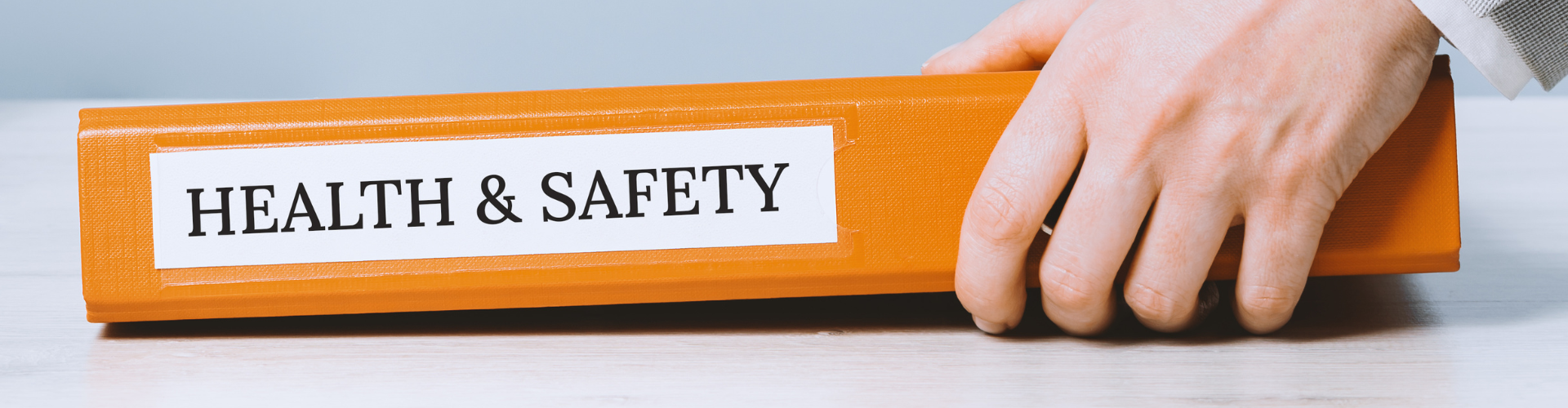 Film crew on location with warning signs, cones and safety gear to show safe media production